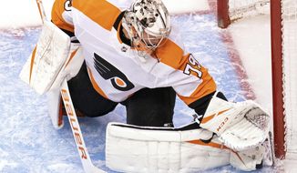 Philadelphia Flyers goaltender Carter Hart (79) makes a save against the Tampa Bay Lightning during the second period of an NHL hockey playoff game Saturday, Aug. 8, 2020, in Toronto. (Frank Gunn/The Canadian Press via AP)