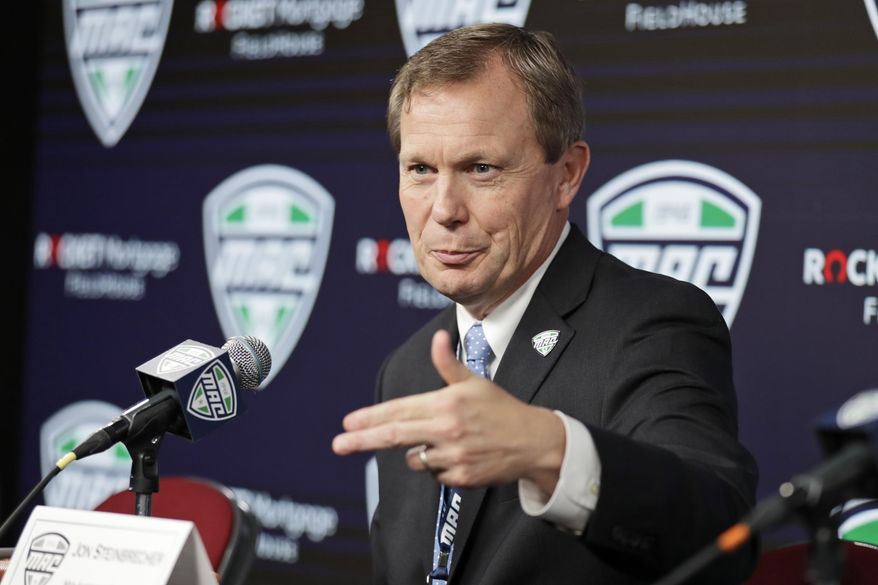 In this March 12, 2020, file photo, Mid-American Conference commissioner Jon Steinbrecher speaks to the media in Cleveland. The Mid-American Conference on Saturday, Aug. 8, 2020, became the first league competing at college football’s highest level to cancel its fall season because of COVID-19 concerns. With the MAC’s 12 schools facing a significant financial burden by trying to maintain costly coronavirus protocols, the conference’s university presidents made the decision to explore a spring season. (AP Photo/Tony Dejak, File) **FILE**