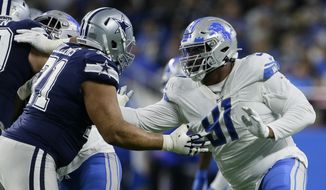 File-Detroit Lions defensive tackle A&#39;Shawn Robinson (91) is blocked by Dallas Cowboys offensive tackle La&#39;el Collins (71) during the second half of an NFL football game, Sunday, Nov. 17, 2019, in Detroit. New Los Angeles Rams defensive tackle Robinson is sidelined indefinitely with a non-football injury, coach Sean McVay says. The Rams put Robinson on the active/non-football injury list Saturday, and McVay discussed their new signee&#39;s prognosis Sunday, Aug. 9, 2020, without disclosing the nature of Robinson&#39;s condition, which isn&#39;t coronavirus-related. (AP Photo/Duane Burleson, File)