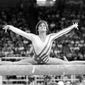 FILE - In this Aug. 3, 1984, file photo, Mary Lou Retton, of the United States, performs on the balance beam during the women&#39;s gymnastics individual all-around finals at the Summer Olympic Games in Los Angeles. (AP Photo/Suzanne Vlamis, File)