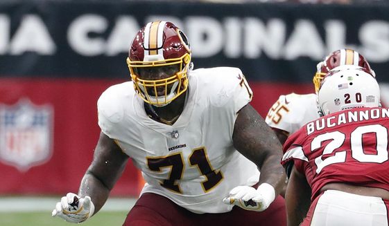 In this Sept. 9, 2018, file photo, Washington Redskins offensive tackle Trent Williams (71) crouches during an NFL football game against the Arizona Cardinals in Glendale, Ariz. (AP Photo/Rick Scuteri, File) **FILE**