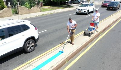 Staten Island artist Scott LoBaido is fighting city hall after he was told to remove a blue line he painted outside the 122nd Precinct, even though New York City officials have permitted the painting of giant &quot;Black Lives Matter&quot; murals on city streets. (Photo courtesy of Scott LoBaido)