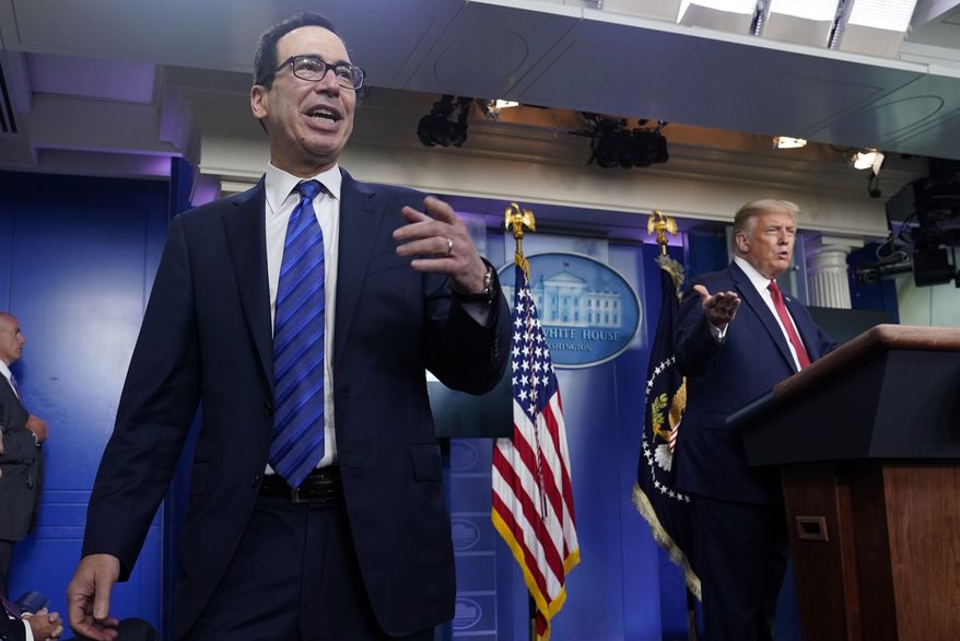 President Donald Trump listens as Treasury Secretary Steven Mnuchin speaks at a news conference in the James Brady Press Briefing Room at the White House, Monday, Aug. 10, 2020, in Washington. (AP Photo/Andrew Harnik) **FILE**