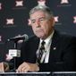 FILE - In this March 11, 2020, file photo, Big 12 Commissioner Bob Bowlsby announces no fans will be admitted to the rest of the Big 12 basketball tournament, in Kansas City, Kan. After the Power Five conference commissioners met Sunday, Aug. 9, 2020, to discuss mounting concern about whether a college football season can be played in a pandemic, players took to social media to urge leaders to let them play. (AP Photo/Orlin Wagner, File)