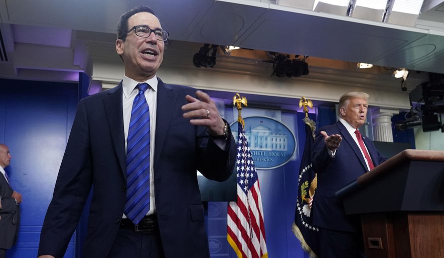 President Donald Trump listens as Treasury Secretary Steven Mnuchin speaks at a news conference in the James Brady Press Briefing Room at the White House, Monday, Aug. 10, 2020, in Washington. (AP Photo/Andrew Harnik)