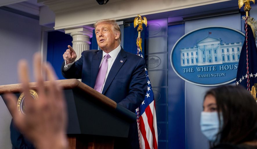 President Donald Trump calls on a reporter as he speaks at a news conference in the James Brady Press Briefing Room at the White House, Tuesday, Aug. 11, 2020, in Washington. (AP Photo/Andrew Harnik)