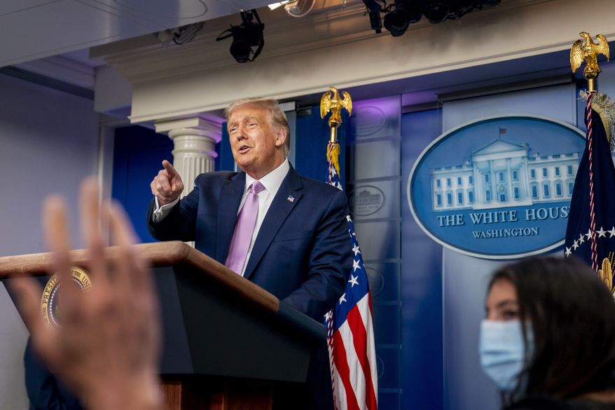 President Donald Trump calls on a reporter as he speaks at a news conference in the James Brady Press Briefing Room at the White House, Tuesday, Aug. 11, 2020, in Washington. (AP Photo/Andrew Harnik)