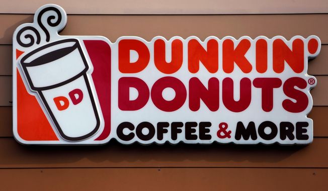 FILE - This Jan. 22, 2018, file photo shows a Dunkin&#x27; Donuts logo on a shop in Mount Lebanon, Pa. The Massachusetts-based coffee and donuts empire is teaming with Post Consumer Brands to release two new breakfast cereals based on two of its most popular coffee drinks: Caramel Macchiato and Mocha Latte. The new cereals are expected to hit grocery shelves in late August 2020. (AP Photo/Gene J. Puskar, File)