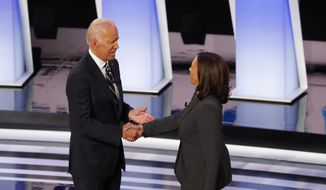 In this July 31, 2019, file photo, former Vice President Joe Biden shakes hands with Sen. Kamala Harris, D-Calif., before the second of two Democratic presidential primary debates at the Fox Theatre in Detroit. Democratic presidential candidate former Vice President Joe Biden has chosen  Harris as his running mate. (AP Photo/Paul Sancya, File)
