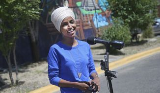 Democrat Rep. Ilhan Omar addresses media after lunch at the Mercado Central in Minneapolis Tuesday, Aug. 11, 2020, primary Election Day in Minnesota. (AP Photo/Jim Mone) **FILE**