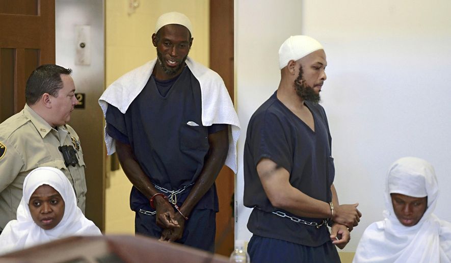 FILE - In this Aug. 13, 2018, file photo, defendants, from left, Jany Leveille, Lucas Morton, Siraj Ibn Wahhaj and Subbannah Wahhaj enter district court in Taos, N.M. A judge has ordered the hospitalization for mental health treatment of a second member of an extended family confronting firearms, kidnapping and terrorism-related charges. The case stems from a 2018 raid on a remote compound in New Mexico where a child's decomposed body was discovered. Court records on Tuesday, Aug. 11, 2020, show 42-year-old Lucas Morton was found incompetent to stand trial by a federal judge and should be committed to a medical center for treatment. (Roberto E. Rosales/The Albuquerque Journal via AP, Pool, File)