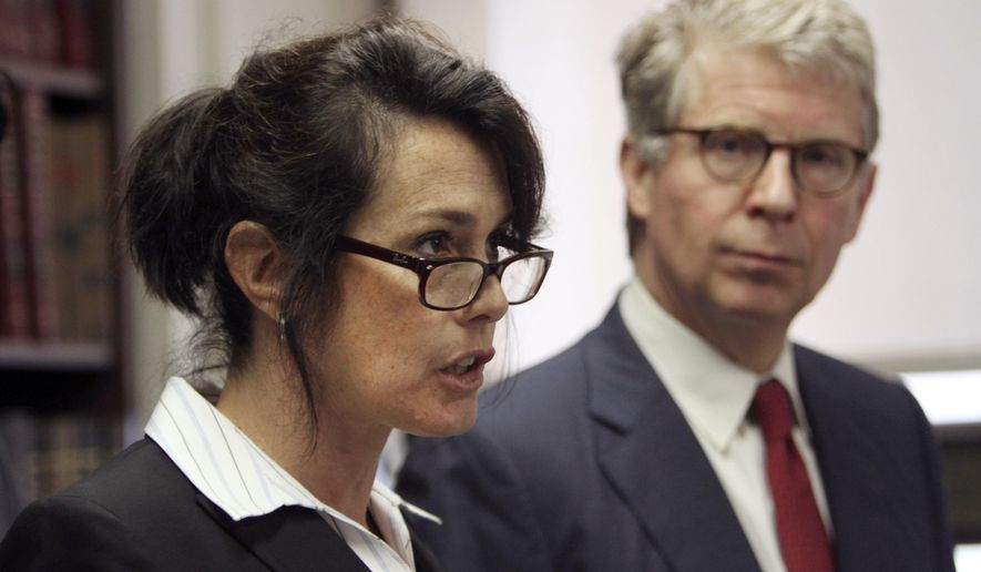 FILE - This June 17, 2011 file photo shows Manhattan District Attorney Cyrus R. Vance Jr., right, as he listens while New York City Police Department Narcotics Inspector Lori Pollock speaks to reporters during a news conference, in New York. Pollock, a former chief who was one of the NYPD's highest-ranking female police officials, accused the department of denying women the opportunity to advance to senior leadership posts in a federal lawsuit. (AP Photo/Mary Altaffer, File)