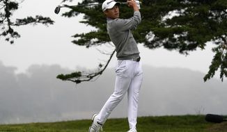 Collin Morikawa watches his tee shot on the 16th hole during the final round of the PGA Championship golf tournament at TPC Harding Park Sunday, Aug. 9, 2020, in San Francisco. (AP Photo/Jeff Chiu)