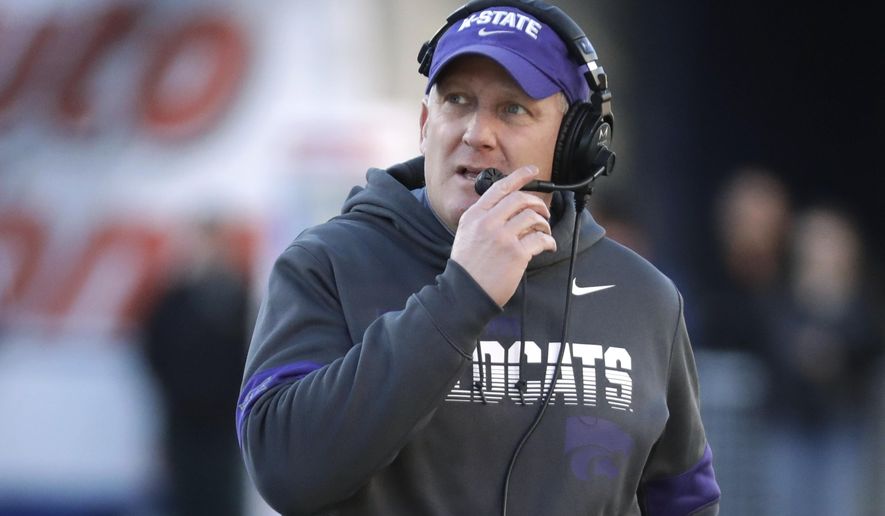 FILE - In this Dec. 31, 2019, file photo, Kansas State coach Chris Klieman watches from the sideline during the first half of the team's Liberty Bowl NCAA college football game against Navy in Memphis, Tenn. The Big Ten and Pac-12 became the first Power Five conferences to cancel their fall football seasons because of concerns about COVID-19. The announcements left the Atlantic Coast Conference, the Southeastern Conference and the Big 12 as thePower Five conferences still intending to play in the fall, and left Klieman clinging to hope. “I hope they don't totally lose a season," he said of his players. (AP Photo/Mark Humphrey, File)