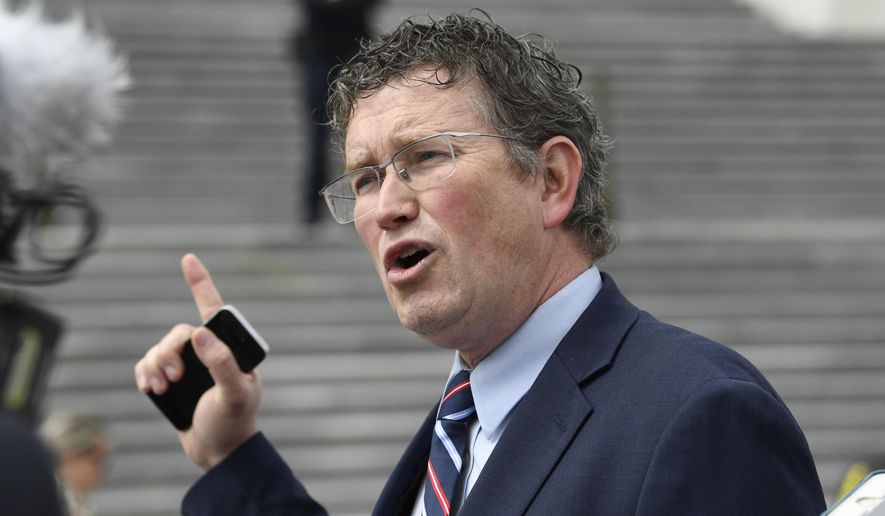 In this March 27, 2020, file photo Rep. Thomas Massie, R-Ky., talks to reporters before leaving Capitol Hill in Washington. (AP Photo/Susan Walsh, File)