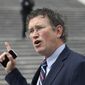 In this March 27, 2020, photo, Rep. Thomas Massie, Kentucky Republican, talks to reporters before leaving Capitol Hill in Washington. (AP Photo/Susan Walsh) **FILE**