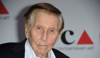 In this April 20, 2013, file photo, media mogul Sumner Redstone arrives at the 2013 MOCA Gala celebrating the opening of the Urs Fischer exhibition at MOCA, in Los Angeles. Redstone, the strong-willed media mogul whose public disputes with family members and subordinates made him a feared operator in Hollywood, died Wednesday, Aug. 12, 2020. (Photo by Richard Shotwell/Invision/AP, File)
