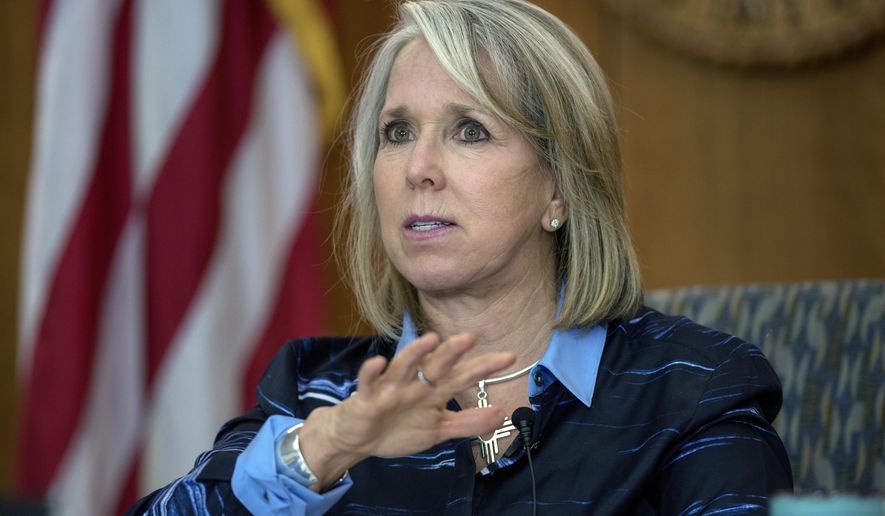 In this July 23, 2020, file photo, New Mexico Gov. Michelle Lujan Grisham gives her weekly update on COVID-19 in New Mexico iin Santa Fe, N.M. (Eddie Moore/The Albuquerque Journal via AP)  **FILE**