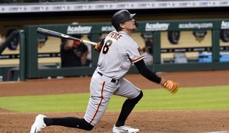 San Francisco Giants&#39; Hunter Pence hits a three-run home run against the Houston Astros during the seventh inning of a baseball game Tuesday, Aug. 11, 2020, in Houston. (AP Photo/David J. Phillip)