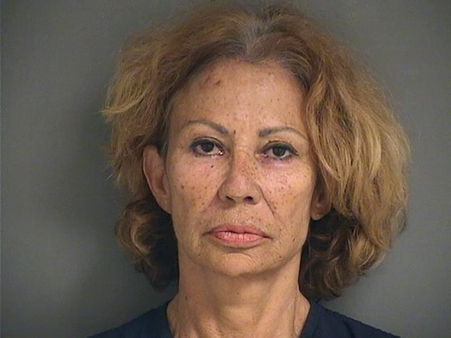 A photo provided by the Palm Beach County Sheriff's Office shows Renata Gloria Ray, who authorities say shot and wounded one woman and threatened another following a confrontation outside a grocery store Sunday afternoon, Aug. 9, 2020, in Lake Worth, Fla. Ray was arrested shortly after the shooting outside a Publix, the Palm Beach County Sheriff’s Office said. She was charged with attempted murder and aggravated assault with a firearm. (Palm Beach County Sheriff's Office via AP)