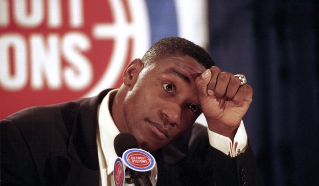 FILE - In this May 11, 1994, file photo, Detroit Pistons guard Isiah Thomas announces his retirement from basketball at the Palace of Auburn Hills, Mich. Thomas&#x27; Olympic hopes were denied, not once but twice. Thomas was famously left off the U.S. Olympic team — the first Dream Team — that won a gold medal at the 1992 Barcelona Olympics with ease. But he could have been an Olympian 12 years earlier, had the Americans not boycotted the 1980 Moscow Games. (AP Photo/Richard Sheinwald, File)