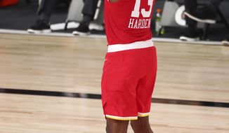 Houston Rockets guard James Harden (13) shoots a three-point basket against the Indiana Pacers in the second half of an NBA basketball game Wednesday, Aug. 12, 2020, in Lake Buena Vista, Fla. (Kim Klement/Pool Photo via AP)