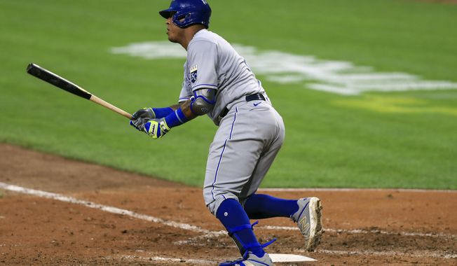 Kansas City Royals&#x27; Salvador Perez singles in the fifth inning during a baseball game against the Cincinnati Reds in Cincinnati, Wednesday, Aug. 12, 2020. (AP Photo/Aaron Doster)