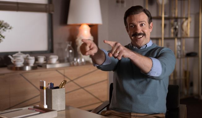 This image released by Apple TV Plus shows Jason Sudeikis in “Ted Lasso,” premiering globally on Friday, August 14, on Apple TV Plus. (Apple TV Plus via AP)