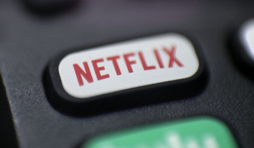 This Aug. 13, 2020, photo shows a logo for Netflix on a remote control in Portland, Ore. (AP Photo/Jenny Kane)