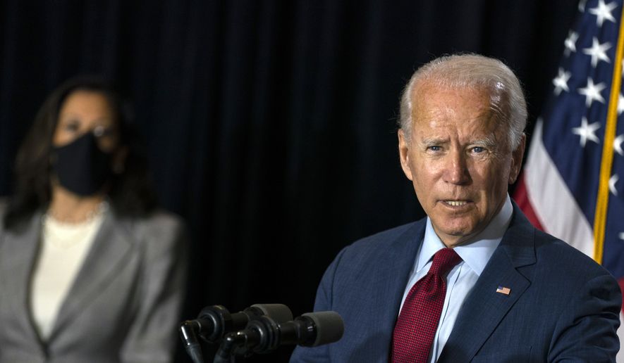 Democratic presidential candidate former Vice President Joe Biden joined by his running mate Sen. Kamala Harris, D-Calif., speaks at the Hotel DuPont in Wilmington, Del., Thursday, Aug. 13, 2020. (AP Photo/Carolyn Kaster)