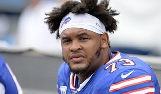 Buffalo Bills offensive tackle Dion Dawkins sits on the bench in the first half of an NFL football game against the Tennessee Titans Sunday, Oct. 6, 2019, in Nashville, Tenn. The Bills are protecting quarterback Josh Allen’s blindside for the long term after signing Dawkins to a four-year, $60 million contract extension. Dawkins has been a starter in Buffalo since being selected in the second round of the 2017 draft out of Temple. He had one year left on his rookie contract, and is now signed through the 2024 season. (AP Photo/Mark Zaleski)