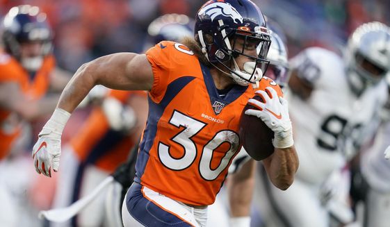 FILE - In this Dec. 29, 2019, file photo, Denver Broncos running back Phillip Lindsay runs with the ball during the second half of an NFL football game against the Oakland Raiders, in Denver. Lindsay insists his noticeably bigger biceps have nothing to do with the Broncos&#39; signing of free agent Melvin Gordon. &amp;quot;I don&#39;t need another man to fuel my fire,&amp;quot; said Lindsay, the only undrafted running back in NFL history to make it to the Pro Bowl as a rookie and to top 1,000 yards rushing in each of his first two seasons as a pro.(AP Photo/Jack Dempsey, File)