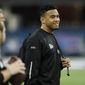 FILE - In this Feb. 27, 2020, file photo, Alabama quarterback Tua Tagovailoa watches a drill at the NFL football scouting combine in Indianapolis. Tagovailoa is happy to keep a low profile befitting his rookie status, even though he’s widely hailed as the Miami Dolphins’ future franchise quarterback. (AP Photo/Charlie Neibergall, File)