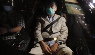 Hong Kong media tycoon and newspaper founder Jimmy Lai, sits in a car as he leaves a police station after being bailed out in Hong Kong, Wednesday, Aug. 12, 2020. The rounding up of the paper’s founder Jimmy Lai, the previous day and a raid on its headquarters have reinforced fears that a new national security law will be used to suppress dissent in Hong Kong after months of anti-government protests.(AP Photo/Kin Cheung)