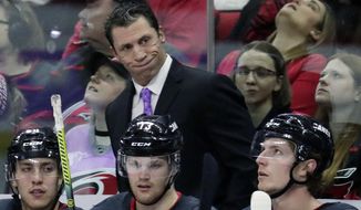 FILE - In this Nov. 23, 2019, file photo, Carolina Hurricanes&#x27; head coach Rod Brind&#x27;Amour reacts to a call during the second period of an NHL hockey game in Raleigh, N.C. Brind’Amour wasn’t going to risk another $25,000 fine from the NHL. The Hurricanes coach provided a short, four-word answer, Thursday, Aug. 13, 2020, when asked if he had anything more to add a day after being fined for calling the league “a joke” in criticizing an officials&#x27; ruling on a goal challenge.(AP Photo/Chris Seward, File)