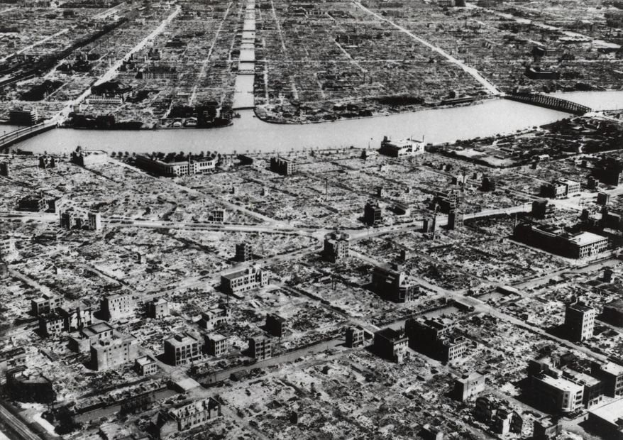 This aerial photo taken on March 9, 1945, shows the industrial section of Tokyo along the Sumida River. The nuclear bombs dropped by the United States on Hiroshima and Nagasaki in August 1945 secured Japan&#x27;s surrender and ended World War II. In Japan, war orphans were punished for surviving. They were bullied. They were called trash, sometimes rounded up by police and put in cages. Some were sent to institutions or sold for labor. They were targets of abuse and discrimination. Now, 75 years after the war&#x27;s end, some are revealing their untold stories of recovery and pain, underscoring Japan’s failure to help its own people. (AP Photo, File)