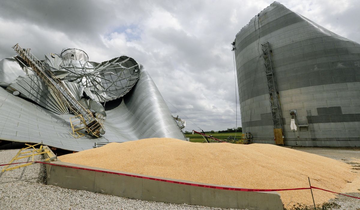 NextImg:Tennessee farmer stuck up to his neck in a grain bin successfully rescued