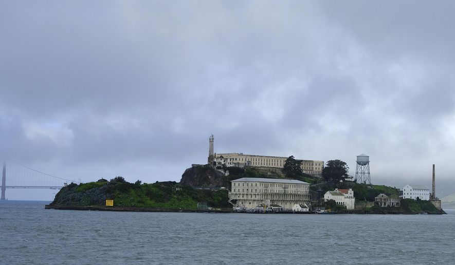 FILE - In this March 6, 2019, file photo, is Alcatraz Island in San Francisco. Alcatraz Island will reopen its outdoor areas to the public next week after being closed for five months due to the pandemic. The Mercury News reports Thursday, Aug. 13, 2020, the island that once housed Al Capone and George "Machine Gun" Kelly will reopen Monday but will be an outdoor-only experience, to reduce the risk of spreading COVID-19. (AP Photo/Eric Risberg, File)