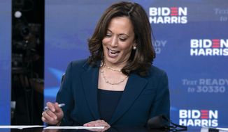 Democratic presidential candidate former Vice President Joe Biden&#x27;s running mate Sen. Kamala Harris, D-Calif., signs required documents for receiving the Democratic nomination for President and Vice President of the United States in Wilmington, Del., Friday, Aug. 14, 2020. (AP Photo/Carolyn Kaster)