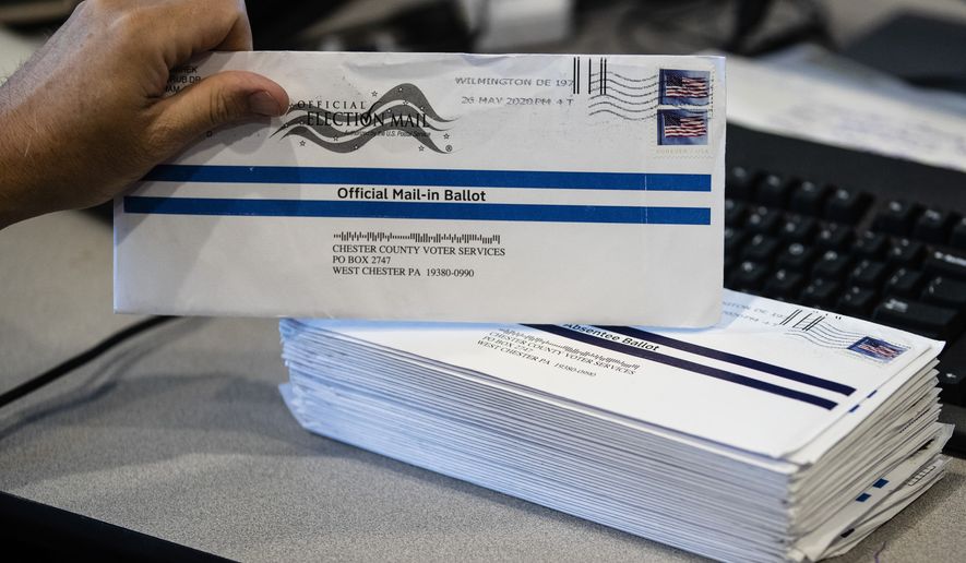In this May 28, 2020, photo, mail-in primary election ballots are processed at the Chester County Voter Services office in West Chester, Pa. (AP Photo/Matt Rourke) **FILE**