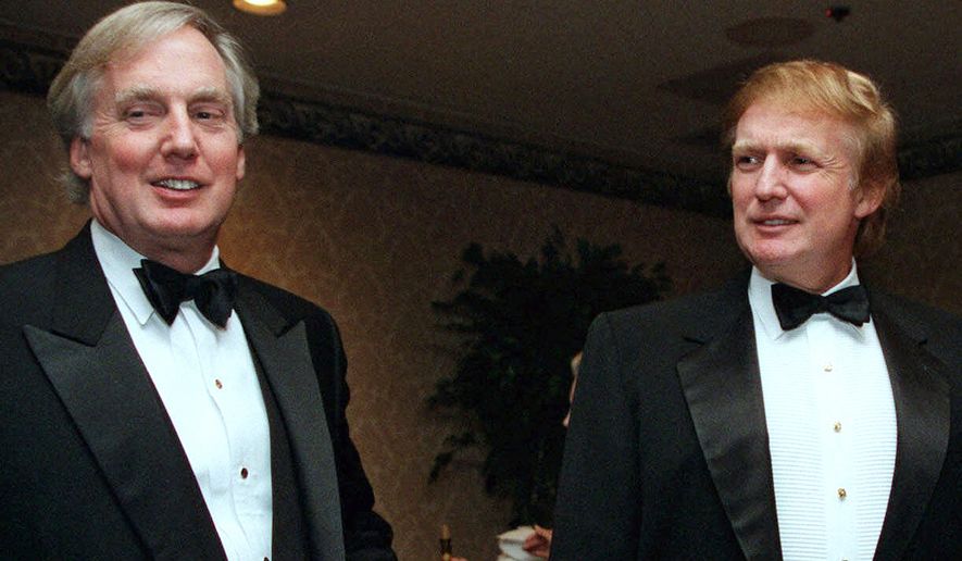 In this Nov. 3, 1999 file photo, Robert Trump, left, joins then real estate developer and presidential hopeful Donald Trump at an event in New York. President Donald Trump&#x27;s younger brother, Robert Trump, has been hospitalized in New York, according to the White House.  The president is expected to visit his 72-year-old brother at a hospital in Manhattan on Friday.  (AP Photo/Diane Bonadreff, File)