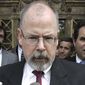 In this April 25, 2006, file photo, U.S. Attorney John Durham speaks to reporters on the steps of U.S. District Court in New Haven, Conn. (AP Photo/Bob Child, File)
