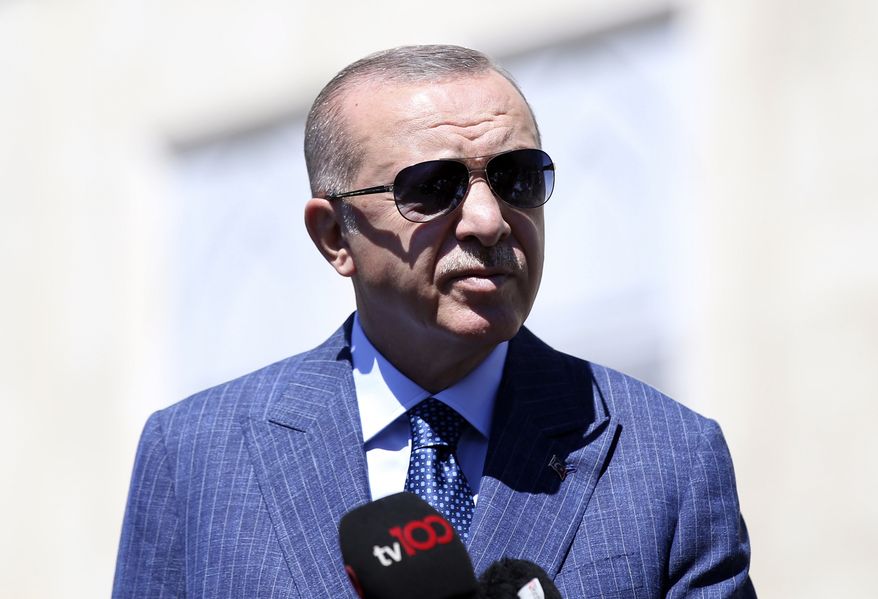 Turkish President Recep Tayyip Erdogan speaks about Turkey-Greece tension after Friday prayers, in Istanbul, Friday, Aug. 14, 2020. Greece's foreign minister traveled to Vienna Friday for urgent talks with his European Union counterparts and Secretary of State Mike Pompeo on military tensions with Turkey, as the Greek and Turkish navies continued a game of brinkmanship over eastern Mediterranean drilling rights.(Turkish Presidency via AP, Pool)
