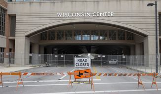 In this Aug. 5, 2020, file photo, The Wisconsin Center in Milwaukee. Joe Biden is poised to unveil his vision for the modern-day Democratic Party in the first presidential nominating convention of the coronavirus era next week. The all-virtual affair will test the former vice president’s ability to overcome unprecedented logistical challenges in an urgent mission to energize his sprawling coalition. (AP Photo/Morry Gash, File)