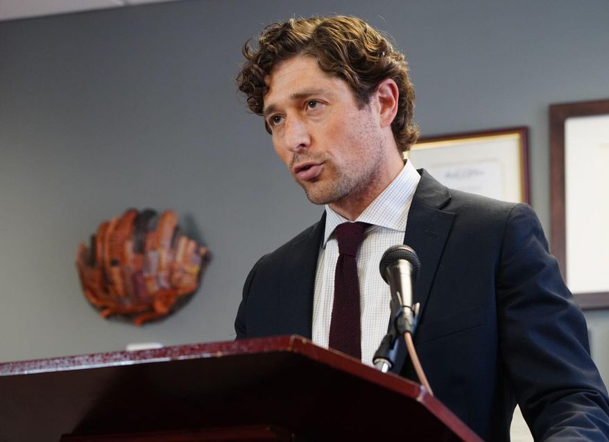FILE - In this May 27, 2020, file photo, Minneapolis Mayor Jacob Frey calls on Hennepin County attorney Mike Freeman to charge the arresting officer in the death of George Floyd as he speaks during a news conference, at City Hall in Minneapolis. Mayor Frey on Friday, Aug. 14, 2020, announced plans to hold open 100 police officer positions next year as part of a hiring freeze to help manage a 2021 budget and as activists are clamoring to shift money away from traditional policing. (Evan Frost/Minnesota Public Radio via AP, File)