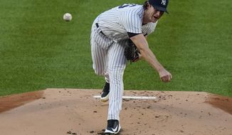 New York Yankees&#39; Gerrit Cole delivers a pitch during the first inning of a baseball game against the Boston Red Sox Friday, Aug. 14, 2020, in New York. (AP Photo/Frank Franklin II)
