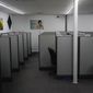 Unattended workstations fill the Teleworks USA job site in Beattyville, Ky., on Wednesday, July 29, 2020. The center is left dormant because of COVID-19 health concerns. (AP Photo/Bryan Woolston) ** FILE **