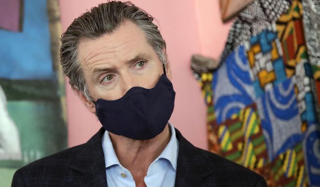 FILE - In this June 9, 2020, file photo, California Gov. Gavin Newsom wears a protective mask on his face while speaking to reporters at Miss Ollie's restaurant during the coronavirus outbreak in Oakland, Calif. Newsom has had a summer of muddled messaging and bad news in the coronavirus fight, a trend crystallized by the governor's delayed response to a data error that caused a backlog of nearly 300,000 virus test results. (AP Photo/Jeff Chiu, Pool, File)