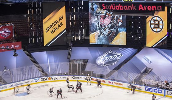 A picture of Boston Bruins goaltender Jaroslav Halak is displayed on a screen during the first period of a NHL first round Stanley Cup playoff game between the Carolina Hurricanes and Boston Bruins in Toronto, on Saturday, Aug. 15, 2020. (Chris Young/The Canadian Press via AP)