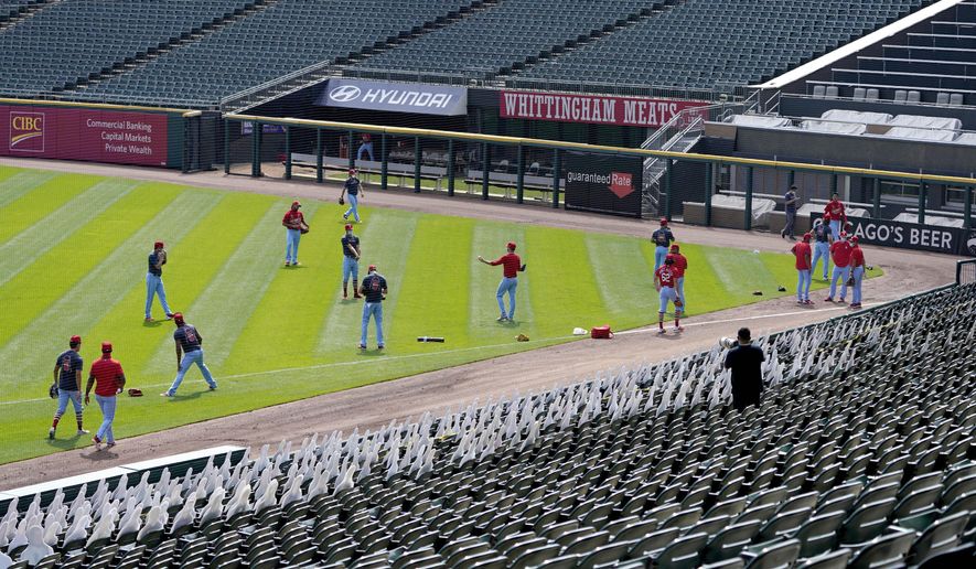 The St. Louis Cardinals workout before a baseball game against the Chicago White Sox Saturday, Aug. 15, 2020, in Chicago. (AP Photo/Charles Rex Arbogast)